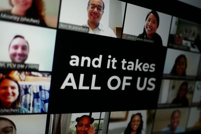 Virtual meeting with images of callers surrounding a banner with the phrase "and it takes all of us".