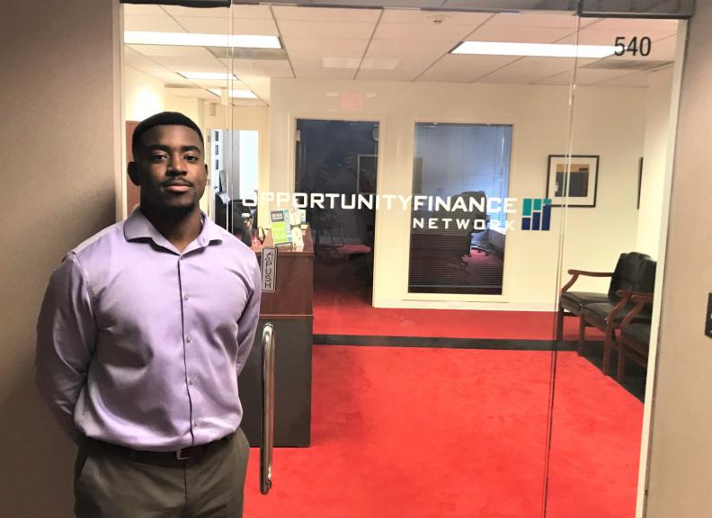 Joshua Chatman OFN intern stands in front of the OFN office