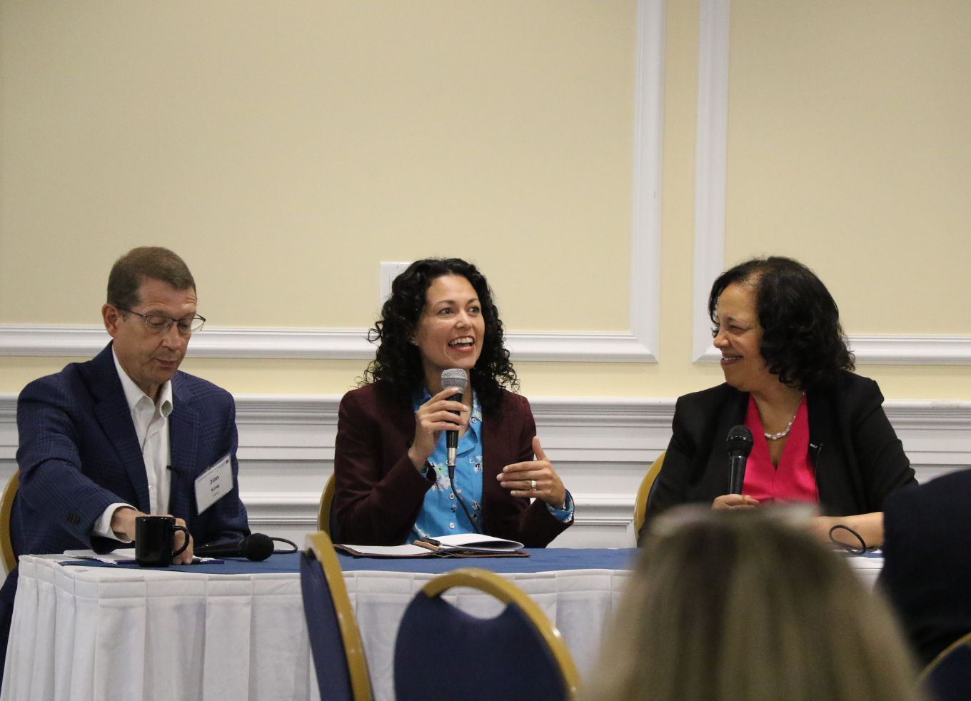 Jim King, Xochitl Torress Small, Lisa Mensah sitting at a table at the Southeast Regional Meeting.