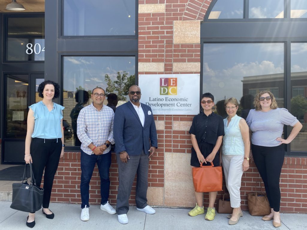 OFN staff and OFN board member Henry Jimenez posing together in front of LEDC building during OFN Midwest regional meeting in Minneapolis