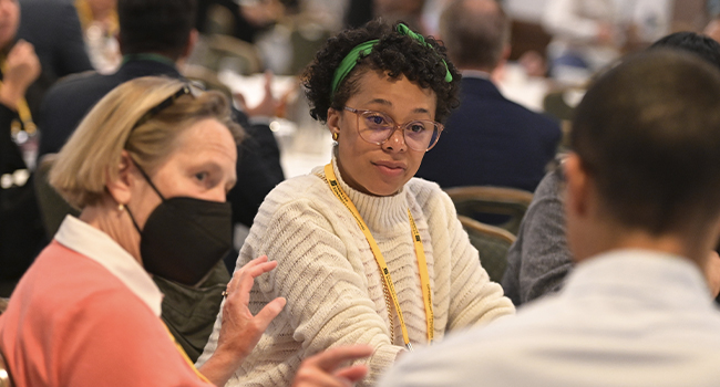 Attendees networking during an OFN conference