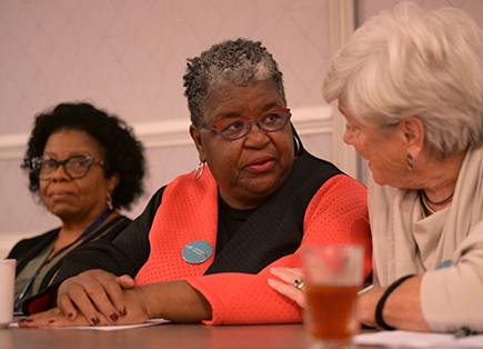 Two women talking at a table