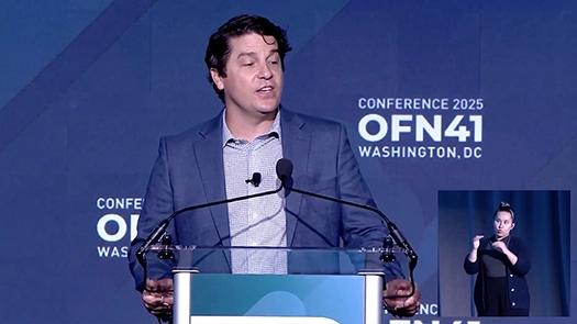 Seth speaking at podium
