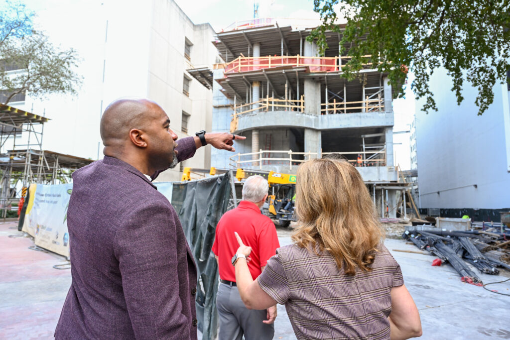 From left to right: Harold Pettigrew, OFN; Alex Rodriguez and Soraya Rivera-Moya , RMCH in front of the construction of the new RMCH facility